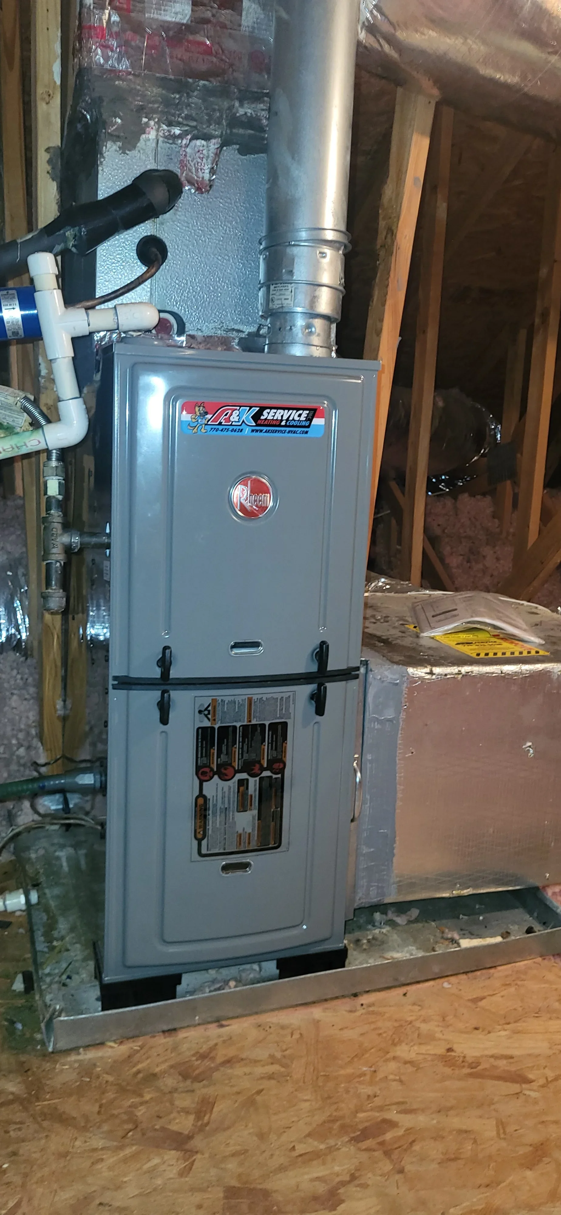 Installed gas furnace with metal ductwork and PVC venting in basement